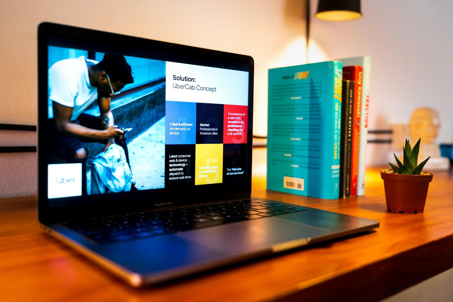 black laptop computer on brown wooden table